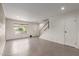 Bright living room with tile flooring, large window, and staircase at 4701 N 68Th St # 214, Scottsdale, AZ 85251