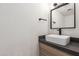 Contemporary half bathroom featuring a vessel sink, modern vanity, and sleek fixtures at 4701 N 68Th St # 214, Scottsdale, AZ 85251