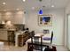 Inviting dining area next to the kitchen features stylish lighting and space for a wine rack at 4800 N 68Th St # 164, Scottsdale, AZ 85251