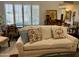 Comfortable living room featuring a white couch, and bright lighting with colorful decor at 4800 N 68Th St # 164, Scottsdale, AZ 85251