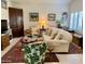 Inviting living room with exposed brick, white sofa, eclectic furniture, and large area rug at 4800 N 68Th St # 164, Scottsdale, AZ 85251