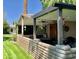 Covered patio with brick wall and ceiling fan is perfect for outdoor entertaining and relaxing at 4800 N 68Th St # 164, Scottsdale, AZ 85251