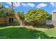 Charming backyard showing an outdoor seating area, lush lawn, garden and a block fence at 4800 N 68Th St # 207, Scottsdale, AZ 85251