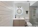 Beautiful bathroom featuring updated vanity, modern lighting, and a glass shower with rainfall showerhead at 4800 N 68Th St # 207, Scottsdale, AZ 85251