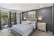 Serene bedroom featuring a queen-sized bed, modern decor, and sliding doors to outdoor patio at 4800 N 68Th St # 207, Scottsdale, AZ 85251
