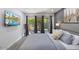 Serene bedroom featuring a queen-sized bed, modern decor, and sliding doors to outdoor patio at 4800 N 68Th St # 207, Scottsdale, AZ 85251