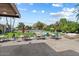 Scenic community pool area with lush greenery and seating at 4800 N 68Th St # 207, Scottsdale, AZ 85251
