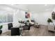 Bright dining room area featuring a modern pendant lamp and views into the living area at 4800 N 68Th St # 207, Scottsdale, AZ 85251