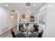 Bright dining room area featuring a modern pendant lamp and views into the kitchen at 4800 N 68Th St # 207, Scottsdale, AZ 85251