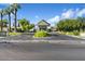 Gated community entrance offering security, lush landscaping, and scenic mountain views in the background at 4800 N 68Th St # 207, Scottsdale, AZ 85251