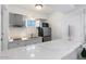 Modern kitchen with stainless steel appliances, sleek countertops, and ample cabinet space at 4800 N 68Th St # 207, Scottsdale, AZ 85251