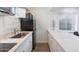 Modern kitchen with stainless steel appliances, sleek countertops, and ample cabinet space at 4800 N 68Th St # 207, Scottsdale, AZ 85251