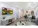 Bright living room featuring wood flooring, a dining area, and an open floor plan at 4800 N 68Th St # 207, Scottsdale, AZ 85251
