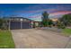 Charming single-story home featuring a two-car garage and a well-manicured lawn under a gorgeous sky at 500 E Hermosa Dr, Tempe, AZ 85282