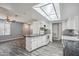 Bright and open kitchen flowing into the living area, showcasing sleek floors and modern appliances at 500 E Hermosa Dr, Tempe, AZ 85282