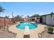 Outdoor pool and yard with a diving board and foliage in a backyard setting at 500 E Hermosa Dr, Tempe, AZ 85282