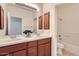 Bathroom featuring double sinks, tile flooring, and a shower-tub combination at 6815 W Carter Rd, Laveen, AZ 85339