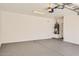 Spacious two car garage featuring an epoxy floor, overhead lighting, and water heater at 6815 W Carter Rd, Laveen, AZ 85339