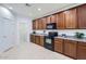Kitchen with modern appliances, tile flooring, and plenty of cabinet space at 6815 W Carter Rd, Laveen, AZ 85339