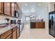 Spacious kitchen featuring an open layout, granite countertops, and wood cabinets at 6815 W Carter Rd, Laveen, AZ 85339