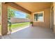 Covered patio featuring a concrete floor, views of the backyard, and outdoor plants at 6815 W Carter Rd, Laveen, AZ 85339