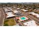 Aerial view of community featuring a pool, mature trees, and nearby carports at 6936 E 4Th St # 5, Scottsdale, AZ 85251