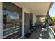 Balcony view of pool and seating, with privacy from sun-blocking window shades at 6936 E 4Th St # 5, Scottsdale, AZ 85251