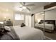 Comfortable bedroom with mirrored closet, plush bedding and modern ceiling fan at 6936 E 4Th St # 5, Scottsdale, AZ 85251