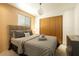 Cozy bedroom featuring a comfortable bed, natural light, and ample closet space for organized living at 6936 E 4Th St # 5, Scottsdale, AZ 85251