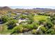 Community park featuring a playground, open green space, walking paths, and mature trees at 7039 W Katharine Way, Peoria, AZ 85383