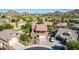 Charming two-story home with a covered balcony, well-manicured front yard, and scenic mountain views at 7039 W Katharine Way, Peoria, AZ 85383
