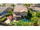 Expansive backyard featuring a private pool, patio area, and lush landscaping with mature trees at 7039 W Katharine Way, Peoria, AZ 85383