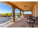Comfortable outdoor balcony with cozy seating, offering scenic neighborhood views at 7039 W Katharine Way, Peoria, AZ 85383