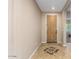 Home entryway featuring neutral walls, tiled floor, and a decorative front door at 7039 W Katharine Way, Peoria, AZ 85383