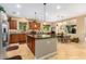 Bright kitchen with granite countertops, a large island, and stainless-steel appliances at 7039 W Katharine Way, Peoria, AZ 85383