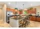 Spacious kitchen featuring a granite island, stainless steel appliances, and ample cabinet space at 7039 W Katharine Way, Peoria, AZ 85383