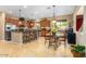 Well-appointed kitchen featuring granite counters, stainless steel appliances, and a cozy breakfast nook at 7039 W Katharine Way, Peoria, AZ 85383