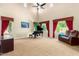 Bright living room with high ceilings, large windows, plush carpet, and a grand piano at 7039 W Katharine Way, Peoria, AZ 85383
