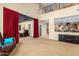 Open living space with two-story ceilings, view of the kitchen, and a cozy home theater at 7039 W Katharine Way, Peoria, AZ 85383