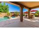 Beautiful pool area with covered patio and built-in barbecue, ideal for relaxation and outdoor entertaining at 7039 W Katharine Way, Peoria, AZ 85383