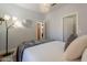 Serene bedroom featuring soft lighting, a modern mirror, and closet access at 7227 E Kramer St, Mesa, AZ 85207