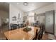 View of the open-concept kitchen and dining area with modern lighting and stylish decor at 7227 E Kramer St, Mesa, AZ 85207