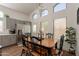 Bright dining area featuring stylish furnishings, an open layout, and stainless steel appliances at 7227 E Kramer St, Mesa, AZ 85207