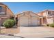 Charming single-story home with a three-car garage and well-maintained desert landscaping in front at 7227 E Kramer St, Mesa, AZ 85207