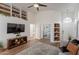 Cozy living room featuring built-in shelving, modern decor, and open doorway, creating an inviting atmosphere at 7227 E Kramer St, Mesa, AZ 85207