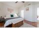 Comfortable main bedroom features decor elements, a modern ceiling fan, and a decorative bench at 7227 E Kramer St, Mesa, AZ 85207