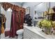 Cozy bathroom features neutral walls, curtains, artwork and vanity at 742 W Puget Ave, Phoenix, AZ 85021