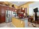 Well-organized kitchen featuring a stainless steel refrigerator and a central island at 742 W Puget Ave, Phoenix, AZ 85021
