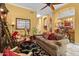 Comfortable living room features neutral walls, ceiling fan, and views into eat-in kitchen at 742 W Puget Ave, Phoenix, AZ 85021