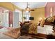 Comfortable bedroom with neutral tones, plantation shutters, and a ceiling fan at 742 W Puget Ave, Phoenix, AZ 85021